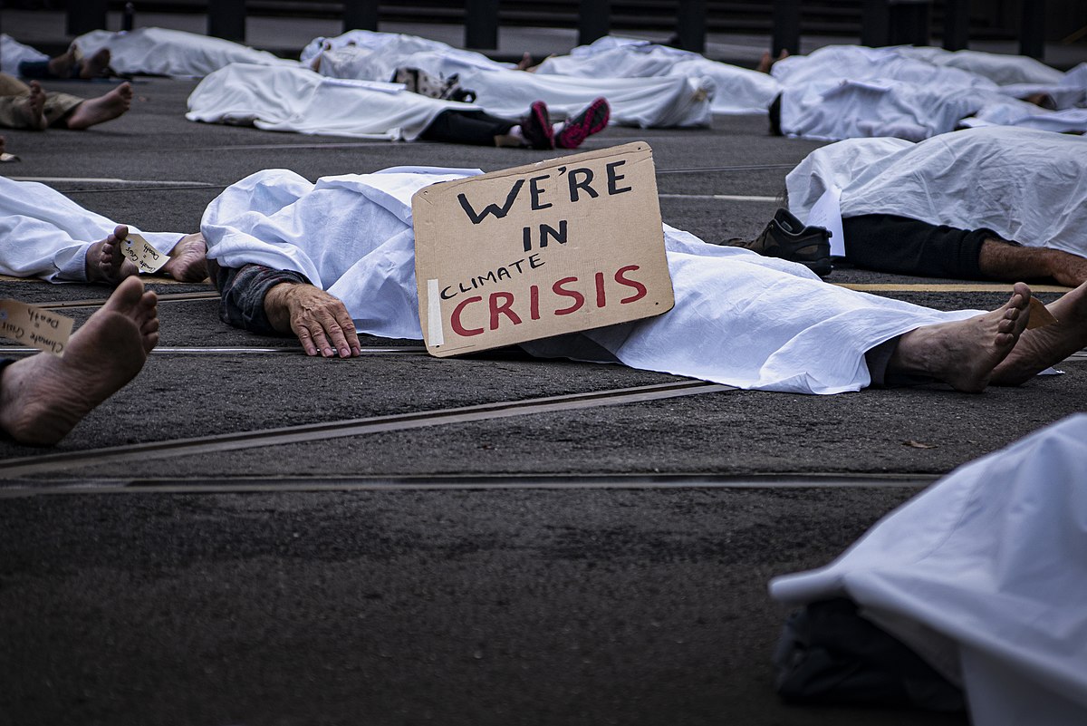 Healthcare workers die-in at the front of the Victorian Parliament, part of Day 1 of Extinction Rebellion's Autumn Rebellion in Melbourne. Photo by Matt Hrkac, CC BY-NC 2.0