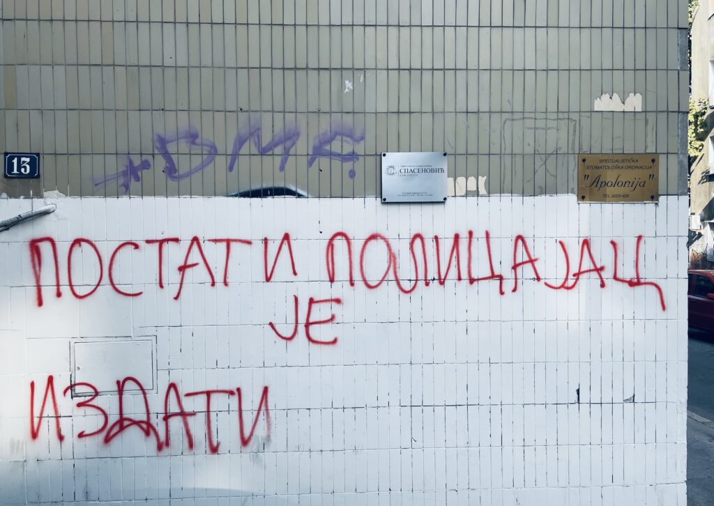 Graffiti translated to, "To become a policeman is to betray."