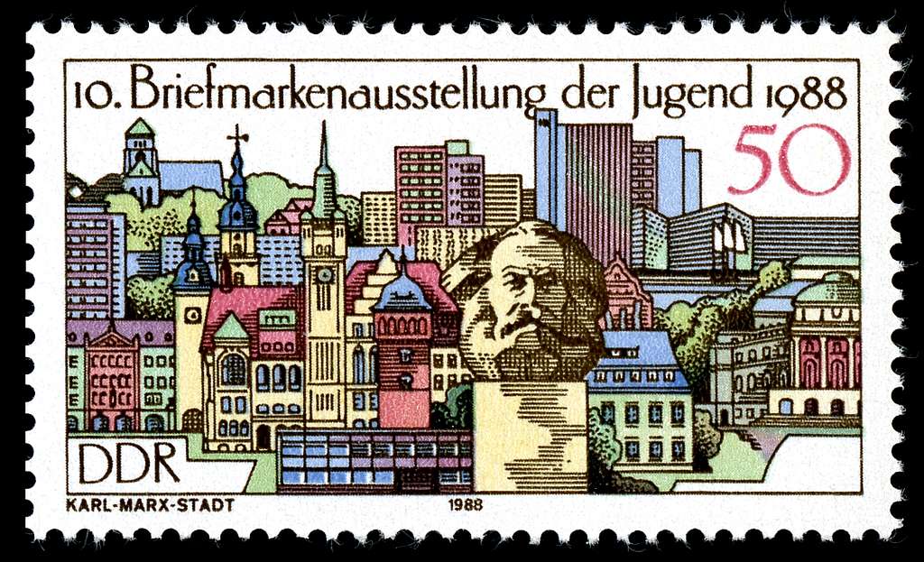 DDR stamp featuring the bust of Karl Marx with a colorful cityscape in the background.
