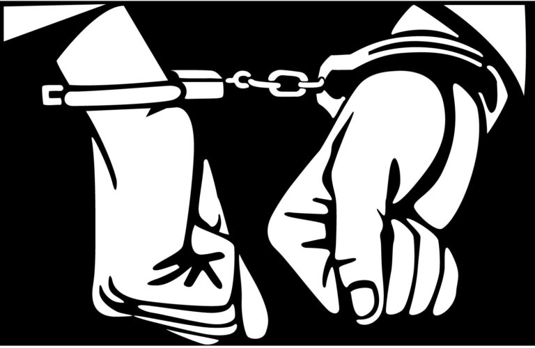 Hands in handcuffs, black and white