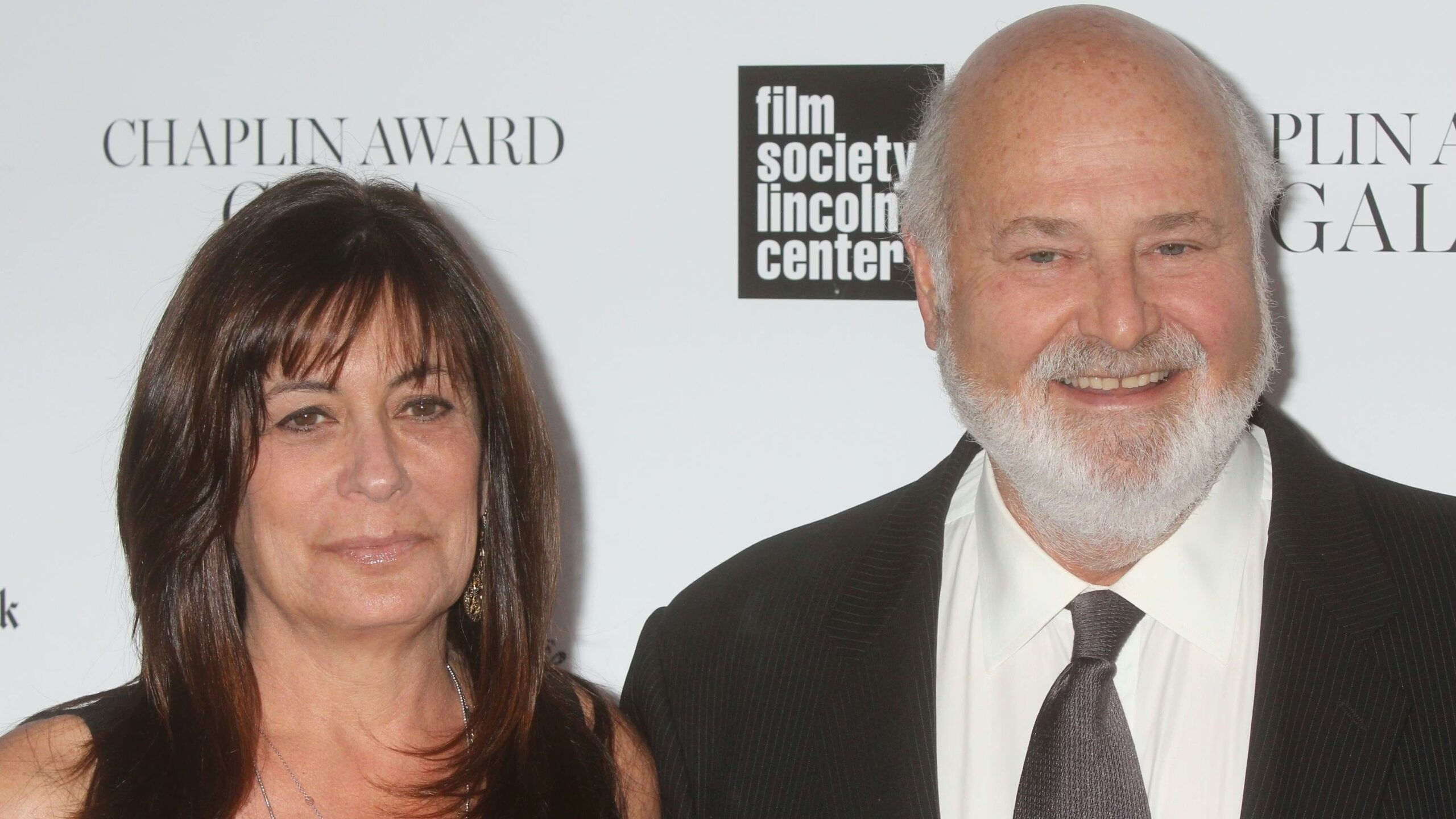 Michelle Singer Reiner and Robert Reiner posing at an event.