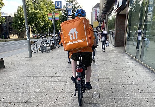 A Lieferando worker on a bike.