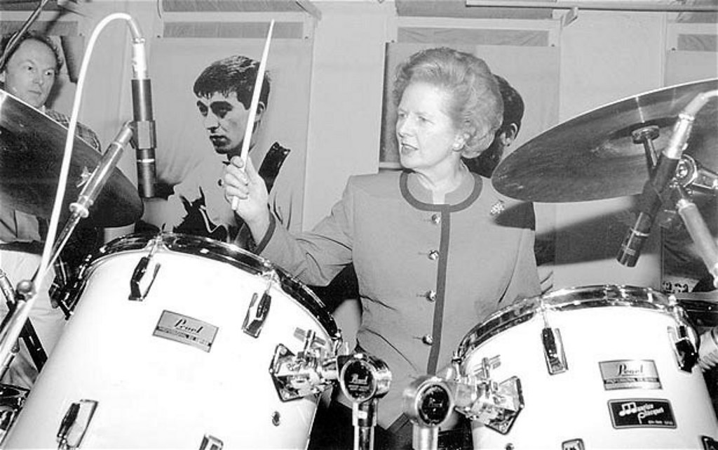 Black and white photo of former Prime Minister Margaret Thatcher playing the drums.